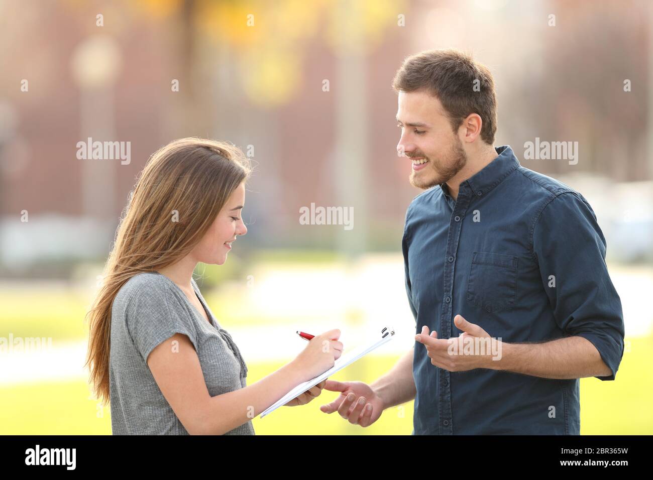 Single man asking a survey standing in the street Stock Photo