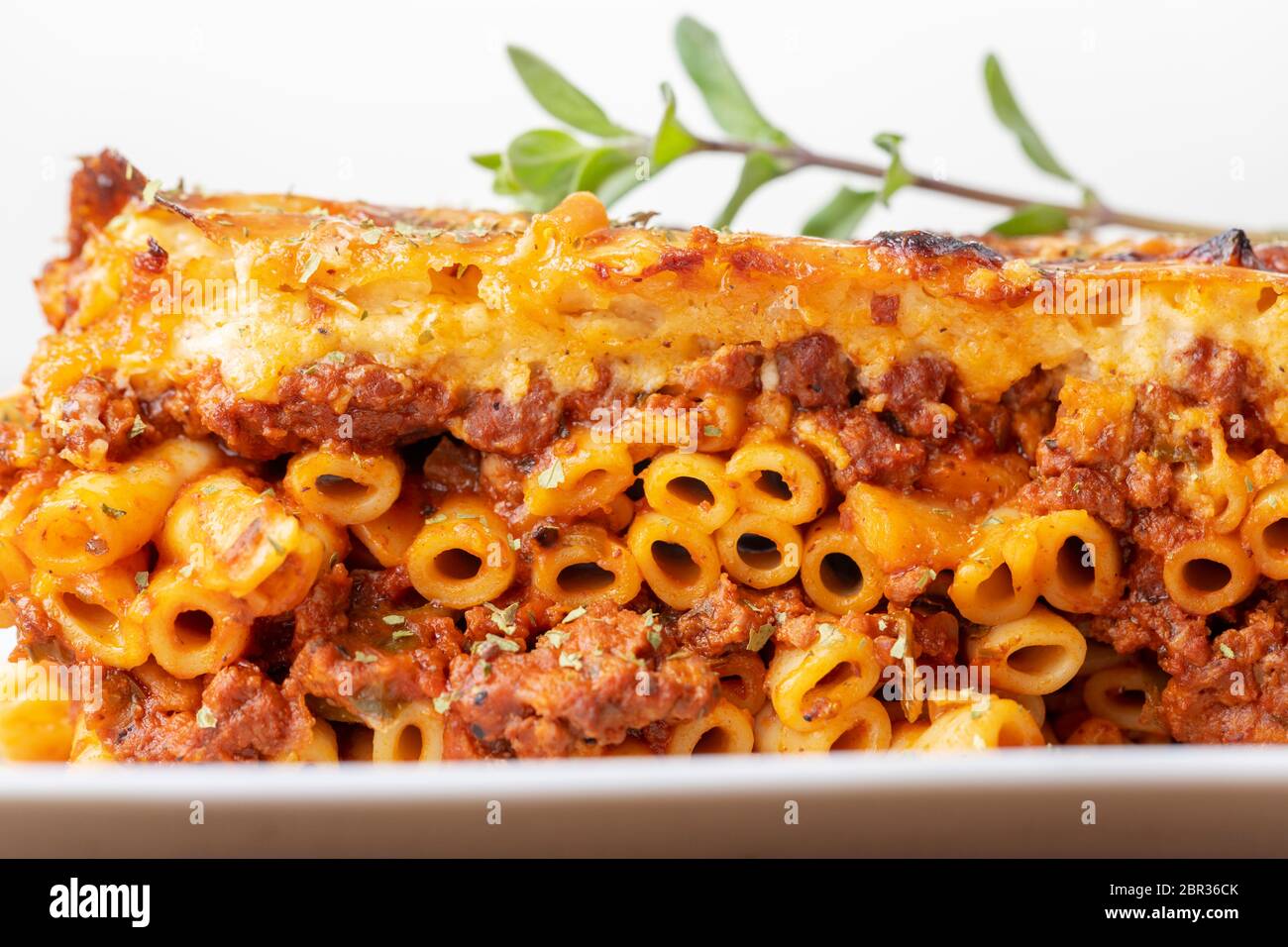greek pastizio noodle dish with cheese Stock Photo - Alamy