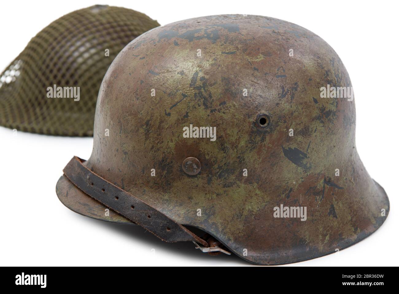 a German World War Two (Stahlhelm M1942) military helmet, Normandy 1944 on the white background Stock Photo