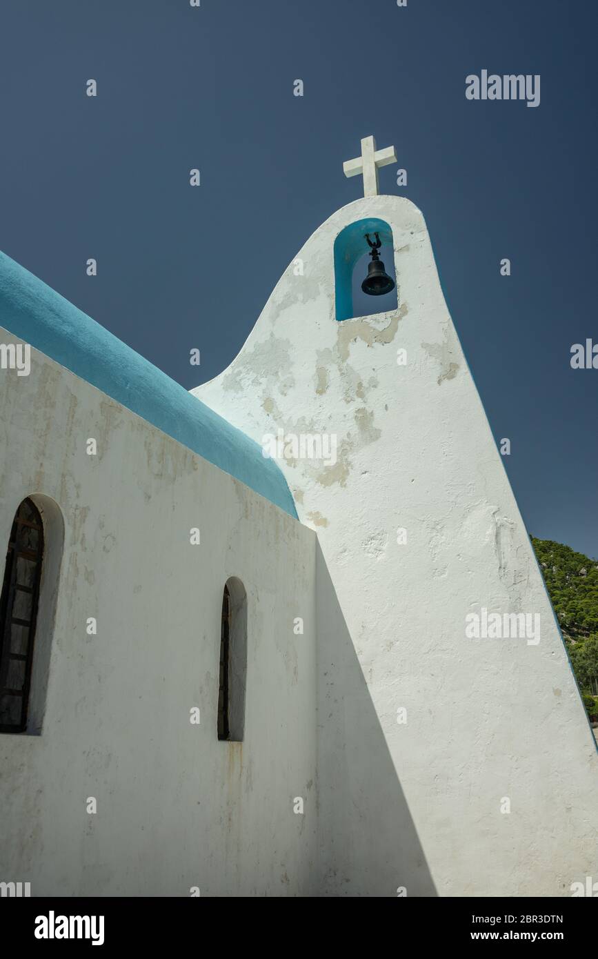 Typical Greek Chapel in Ypanema at Heraion (Vouliagmeni) lake in Greece Stock Photo