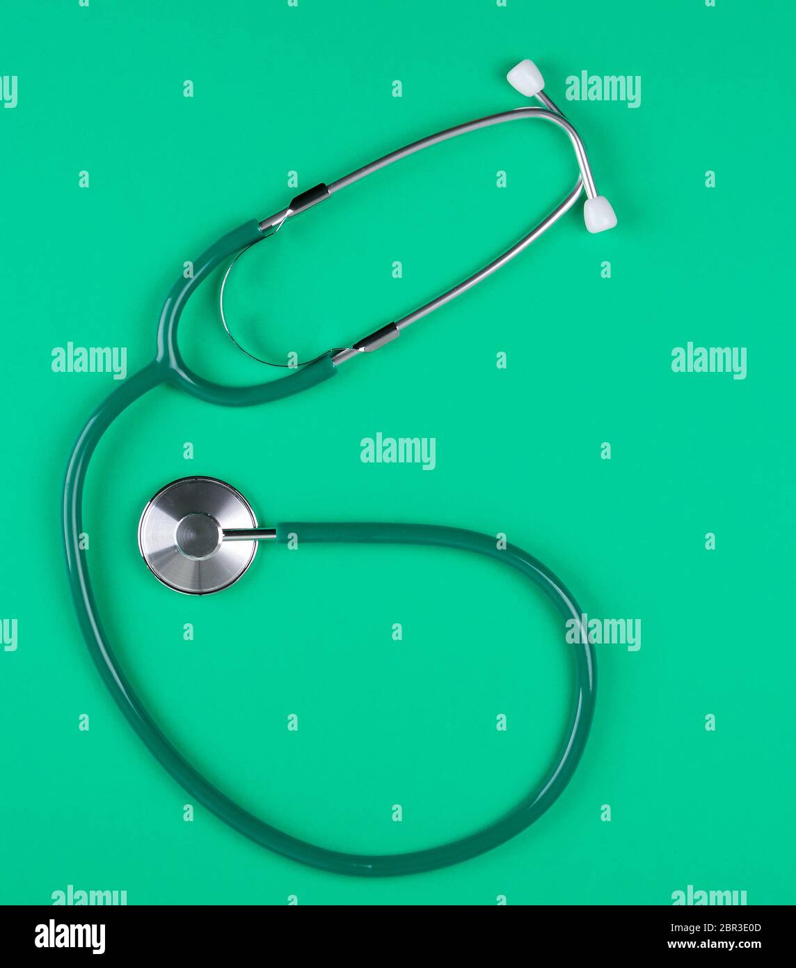 medical stethoscope on green background, top view Stock Photo - Alamy