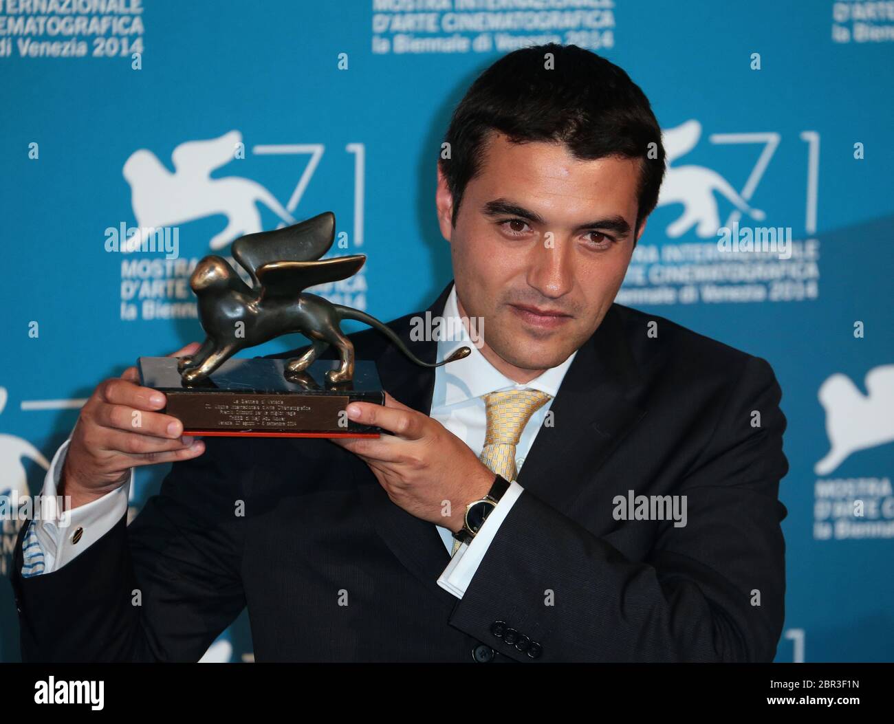 VENICE, ITALY - SEPTEMBER 06: Naji Abu Nowar poses with the Orizzonti Award  for best director he received for his movie 'Theeb' Stock Photo - Alamy
