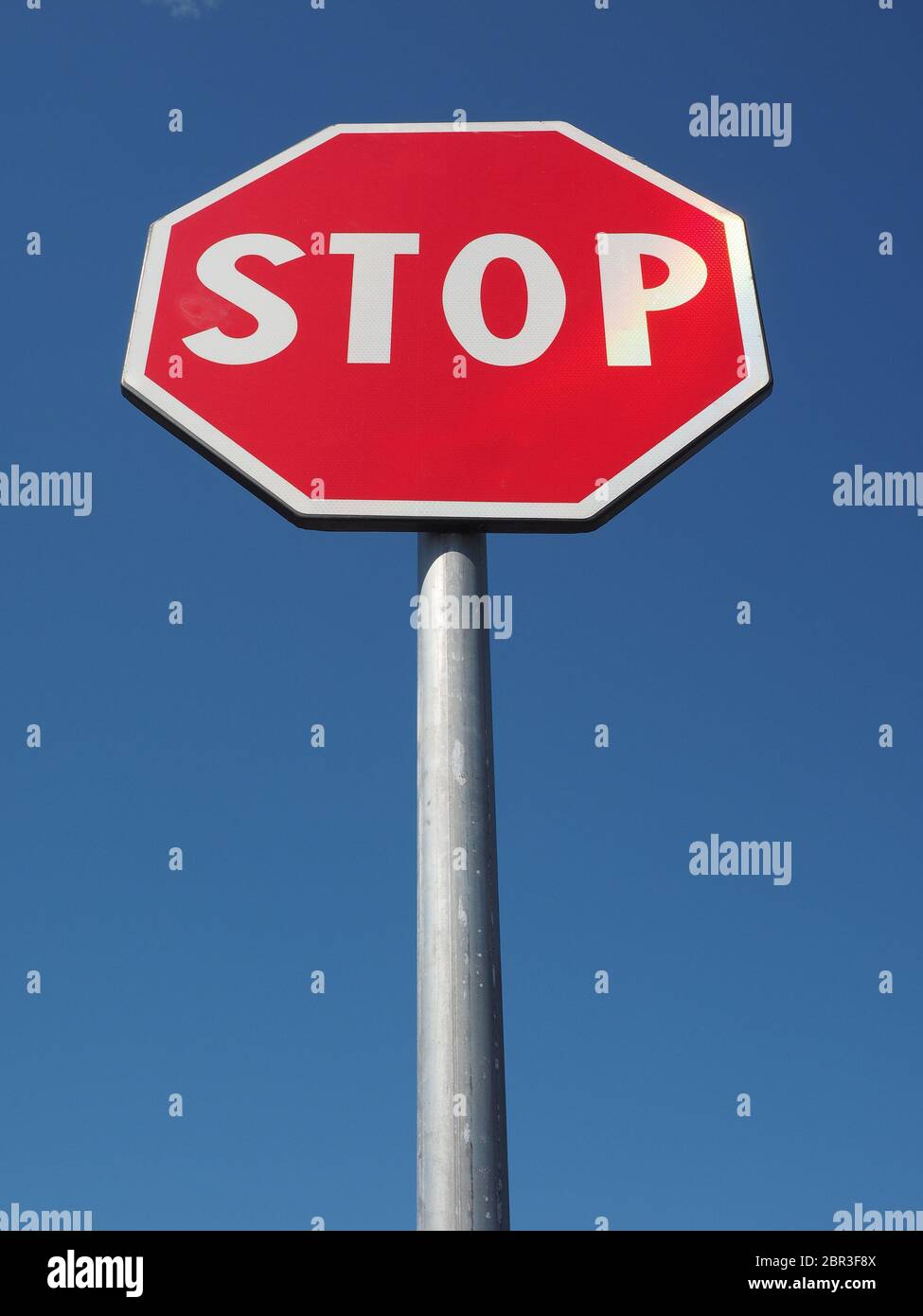 Stop Sign Bird View Warning signs, stop traffic sign over blue sky Stock Photo - Alamy