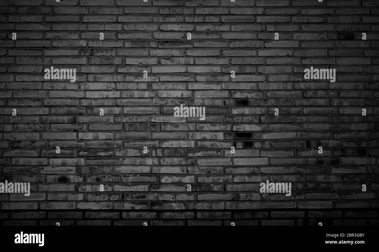 Dark black and grey brick wall background texture Stock Photo Alamy