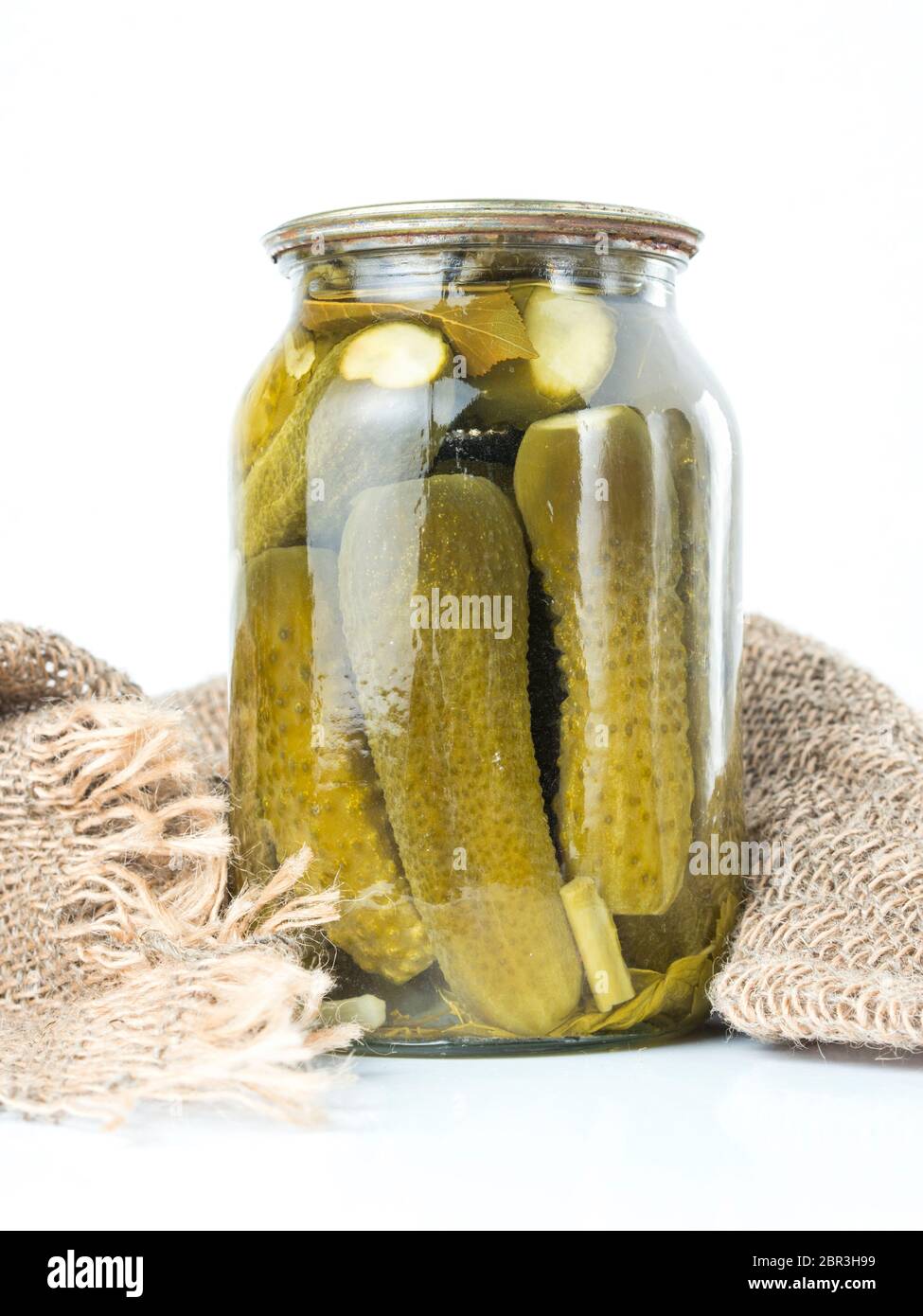 Pickled cucumbers isolated. Pickles in glass jar isolated on white