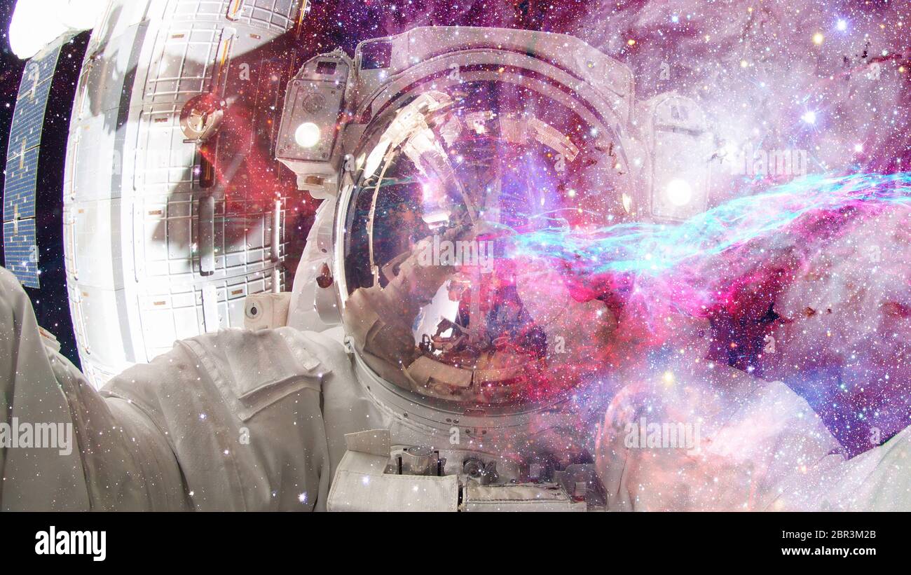 Astronaut in outer space. Science fiction art. Elements of this image ...