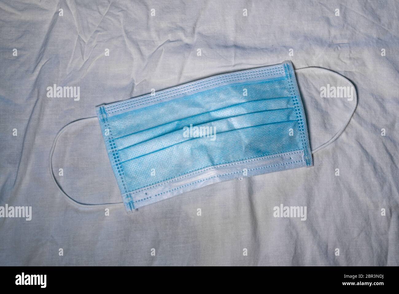 Blue face mask against viruses and other polluting pathogens in the air ...