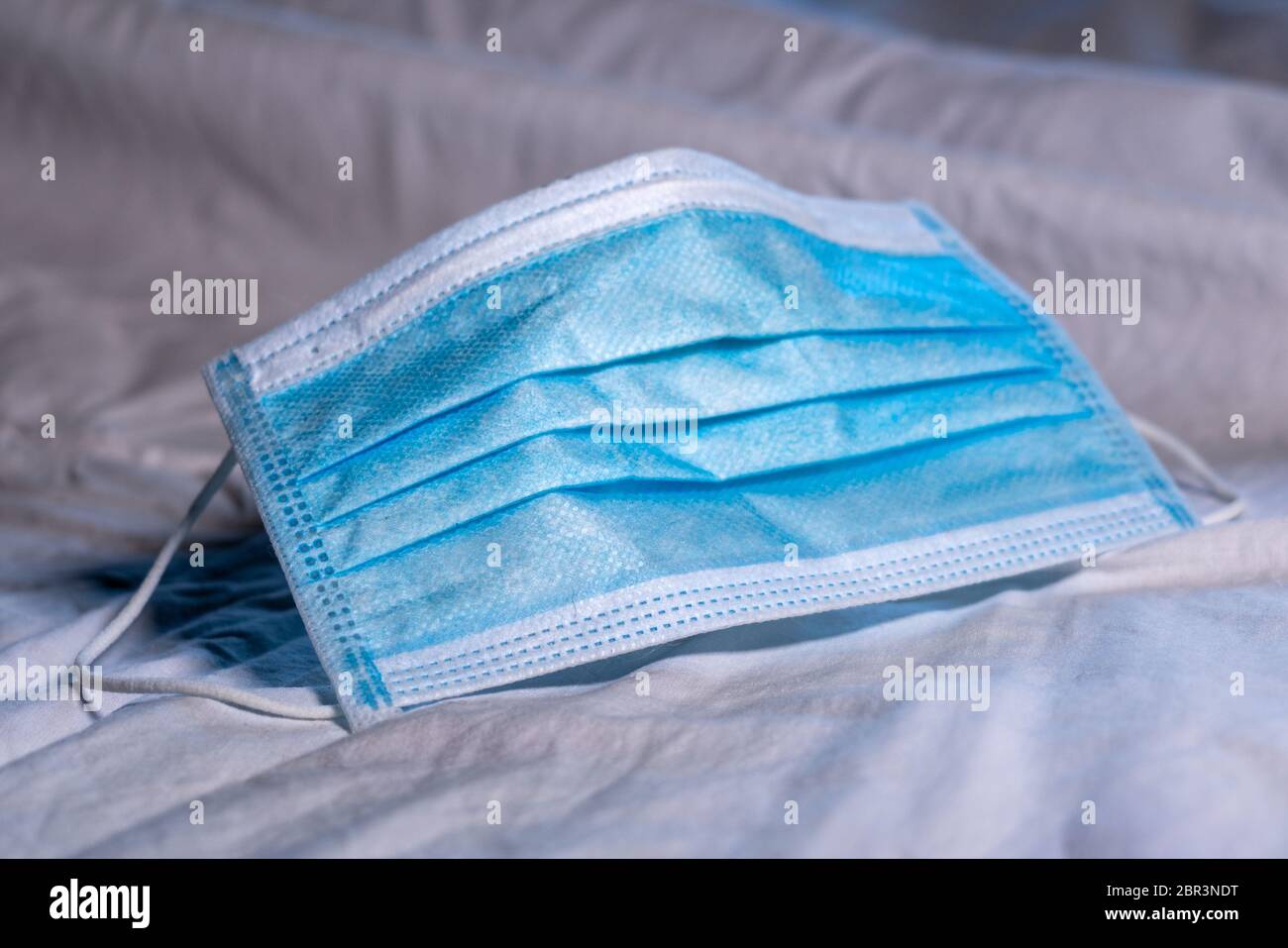 Blue face mask against viruses and other polluting pathogens in the air ...