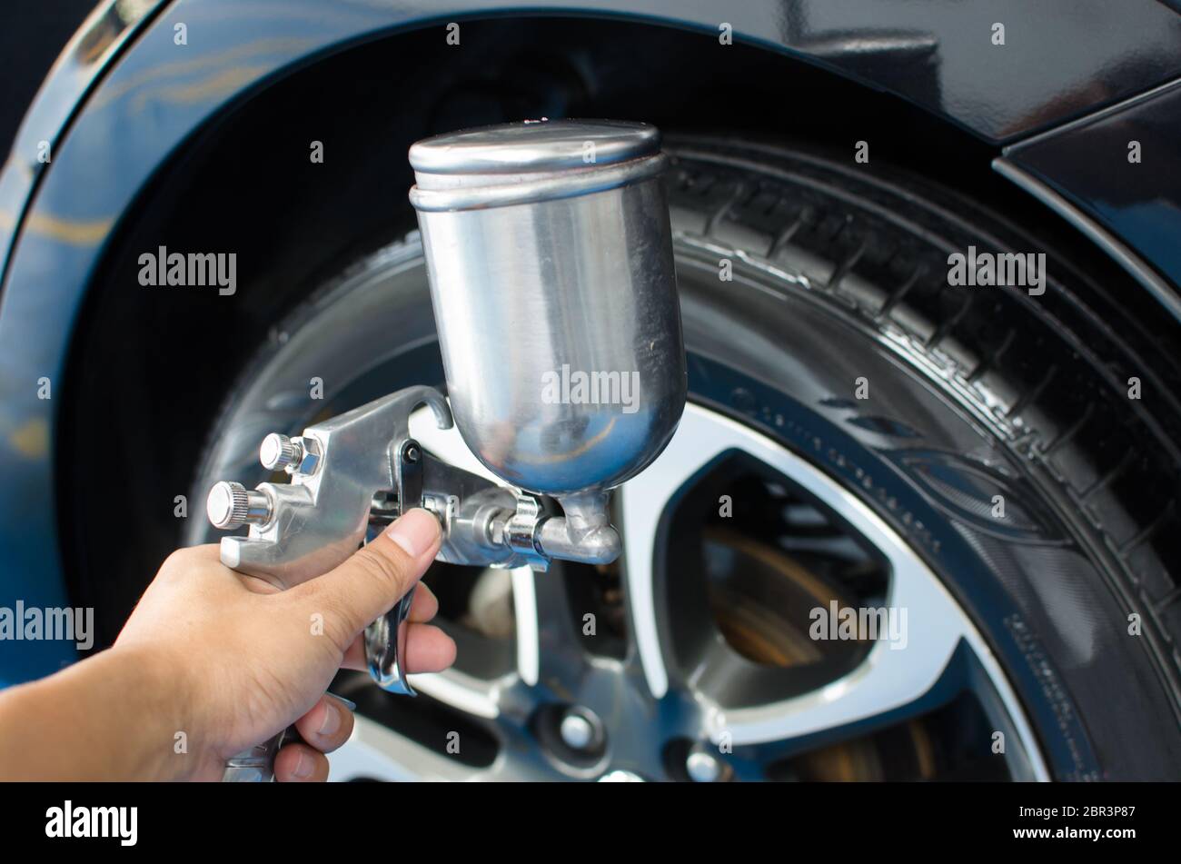 Car wash service. Use liquid spray coating wheel outside the wax Stock