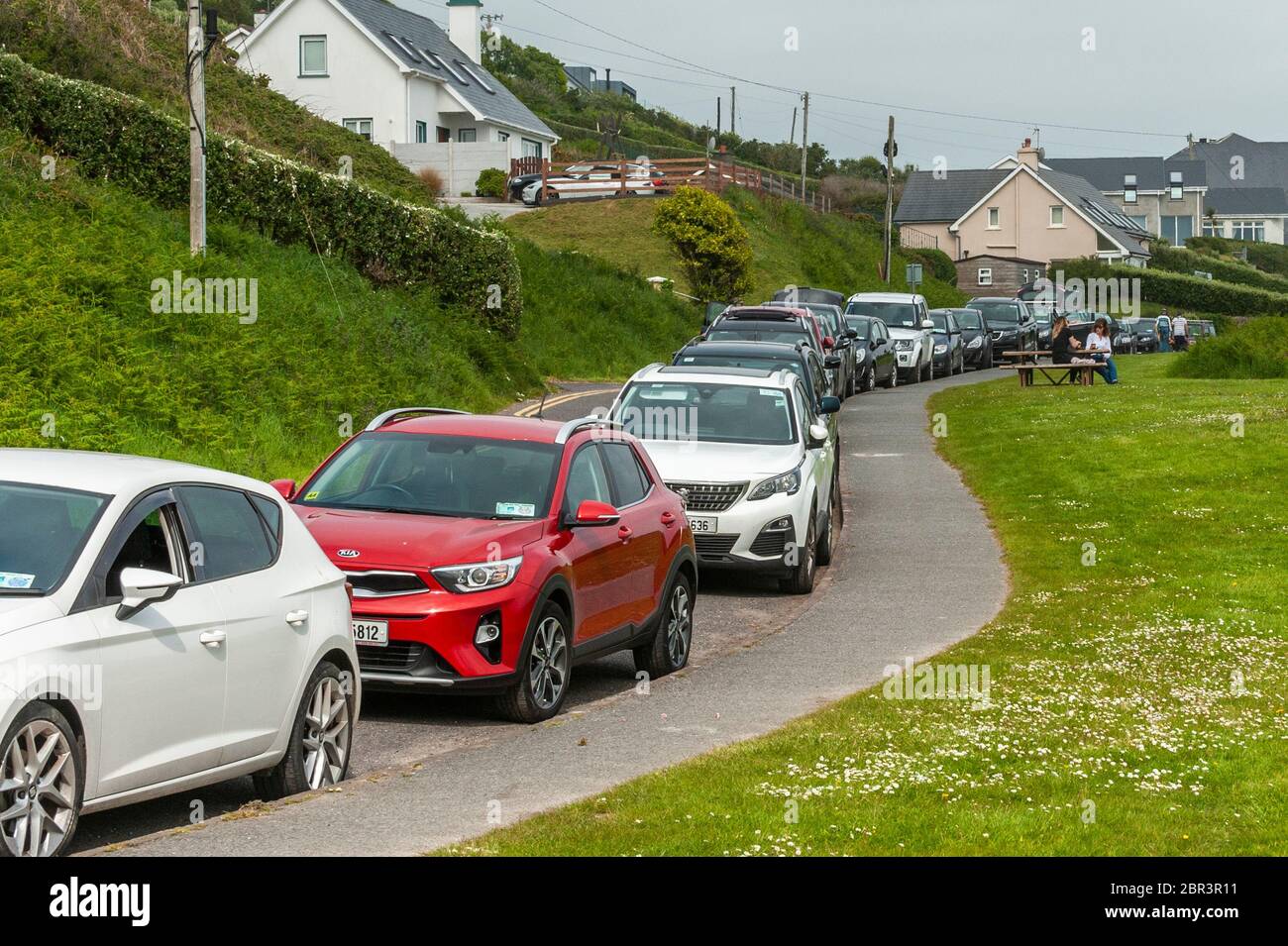 Inchydoney, West Cork, Ireland. 20th May, 2020. The relaxation of some Covid-19 Lockdown restrictions has brought people to Inchydoney Beach in their droves on one of the hottest days of the year today. Credit: AG News/Alamy Live News Stock Photo