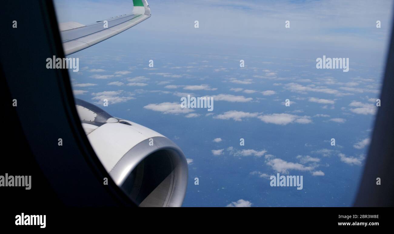 Airplane flying though clouds hi-res stock photography and images - Alamy