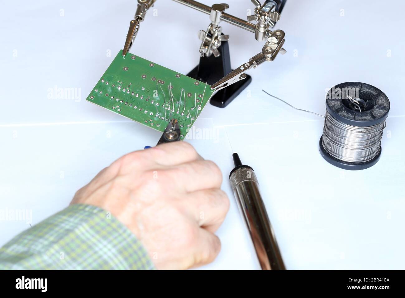 electric technician is installing some digital devices Stock Photo