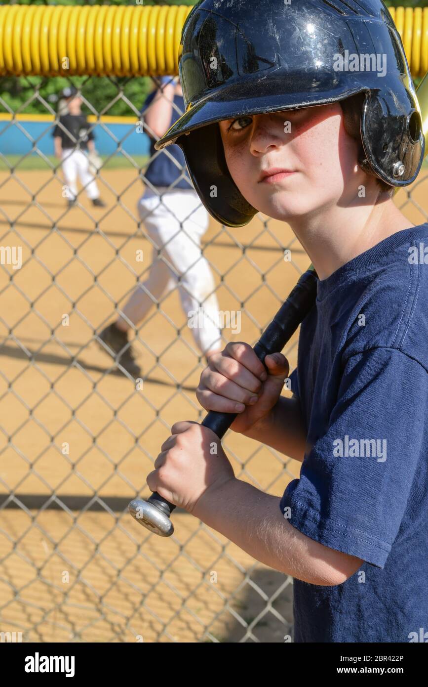 Young boy up to bat in baseball game Stock Photo
