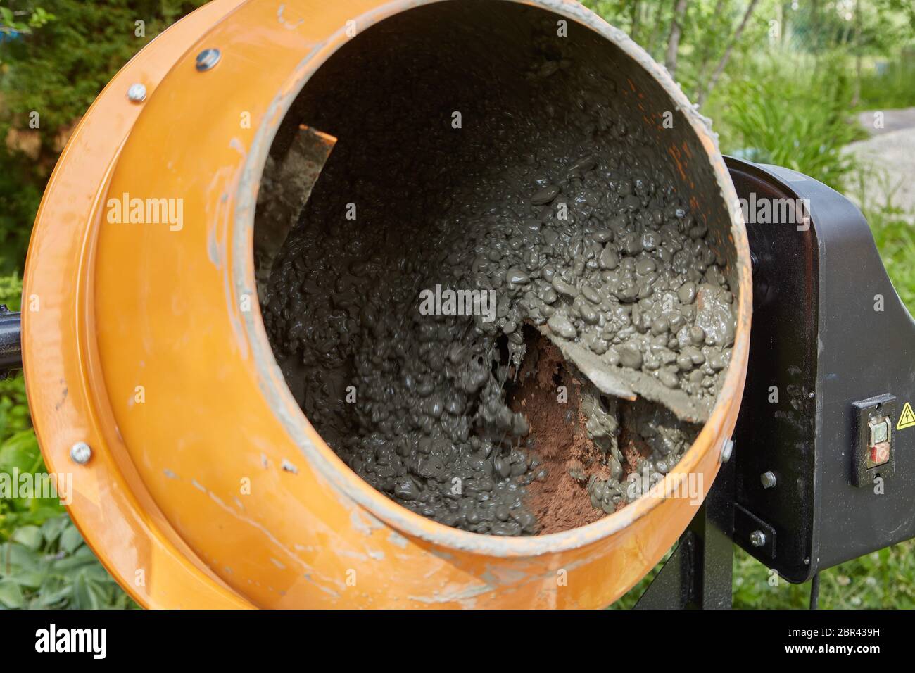 Concrete mixer machine at construction working. Mixing of cement mortar