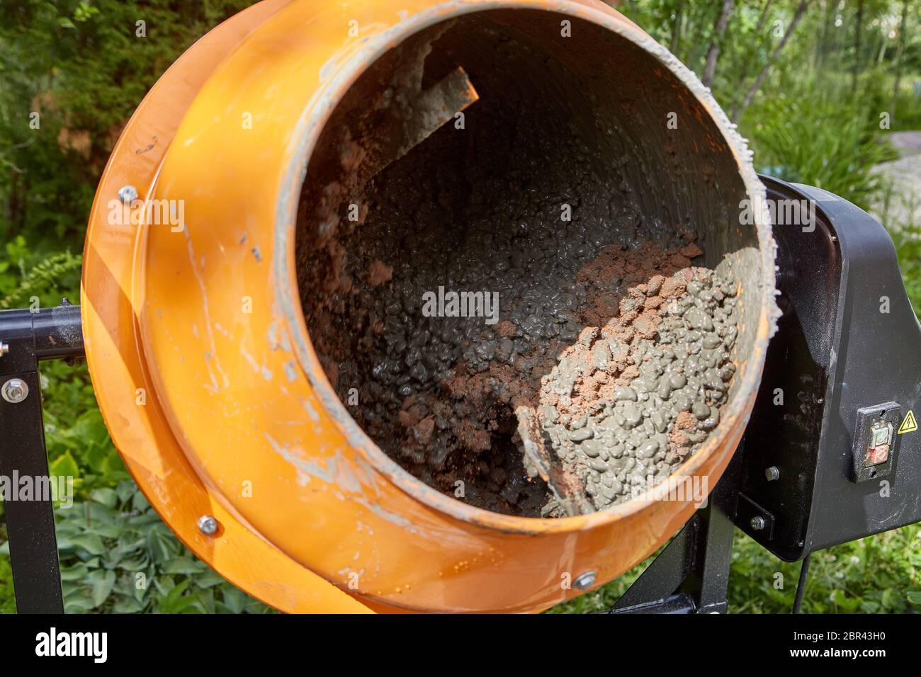 Concrete mixer machine at construction working. Mixing of cement mortar