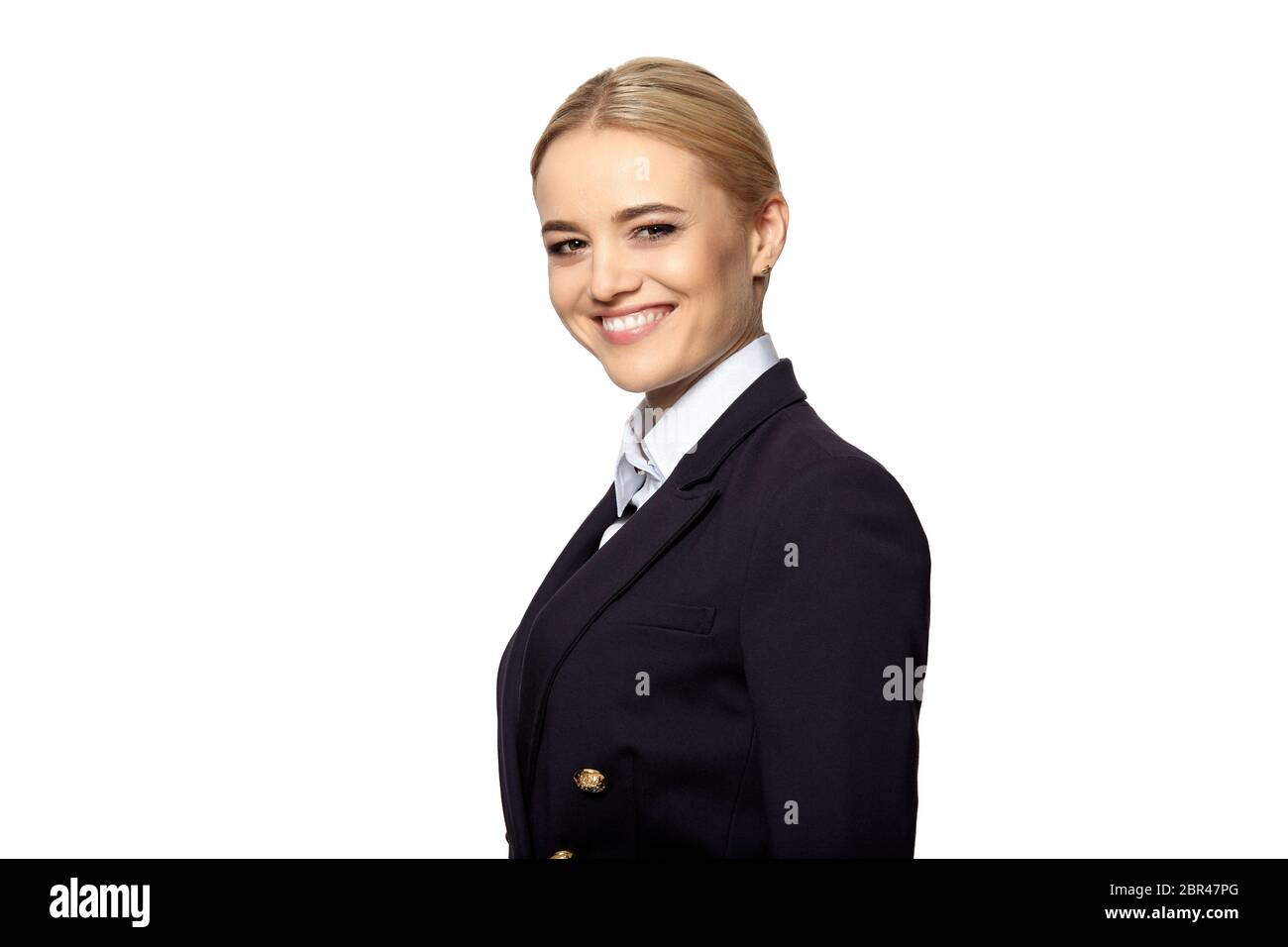 Friendly smiling young business woman in a dark business suit isolated ...