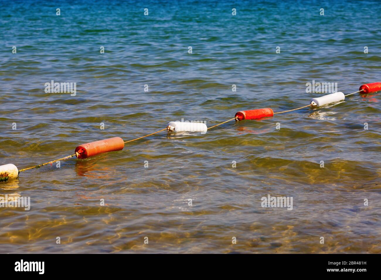 Fencing for swimming. Protective buoys on sea surface. Safety fencing