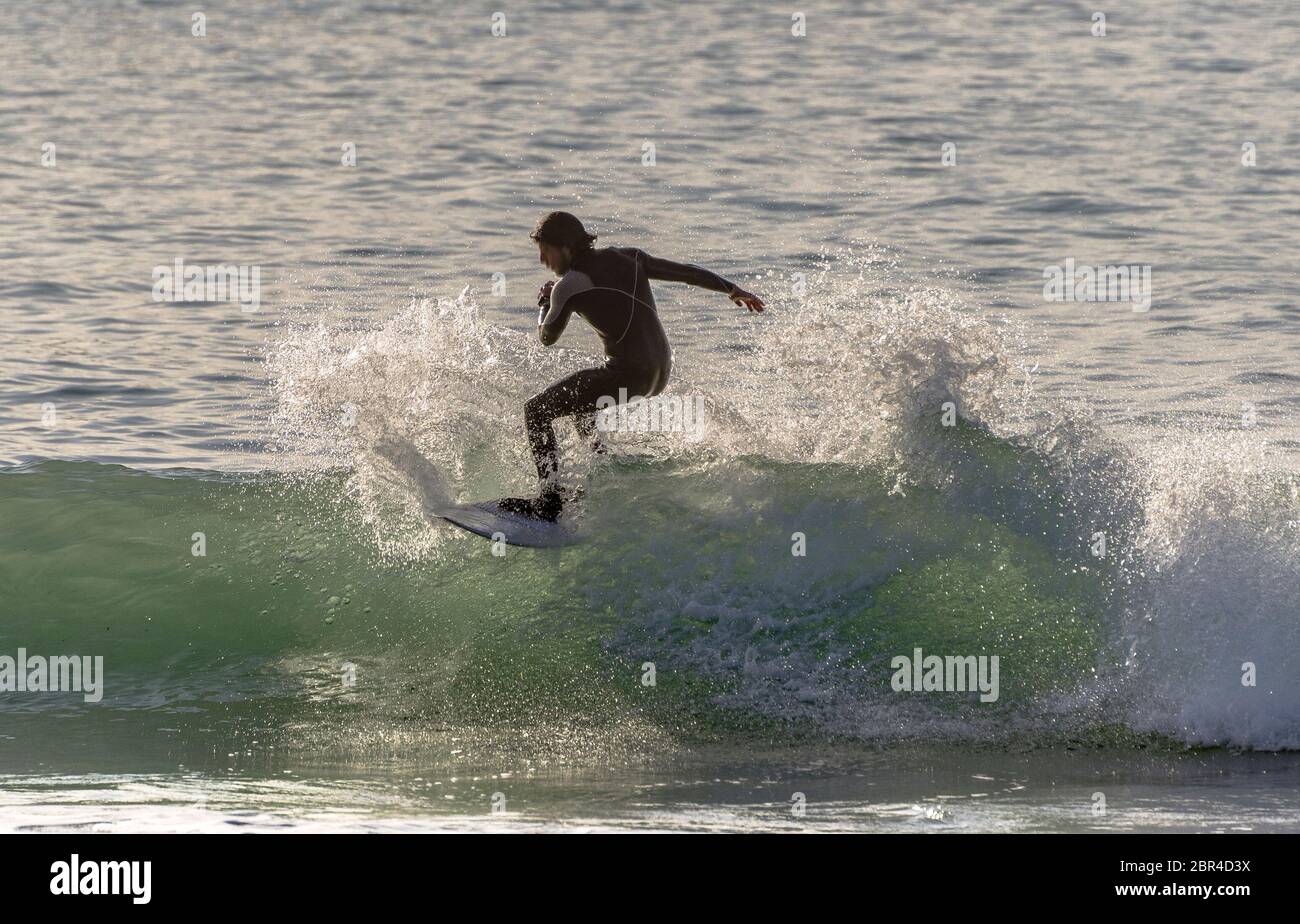 Surfer riding the waves of the sea Stock Photo - Alamy