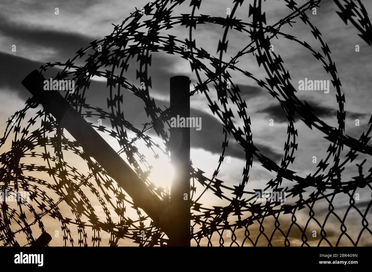Blurred background with rusty metal wire on a fence Stock Photo - Alamy