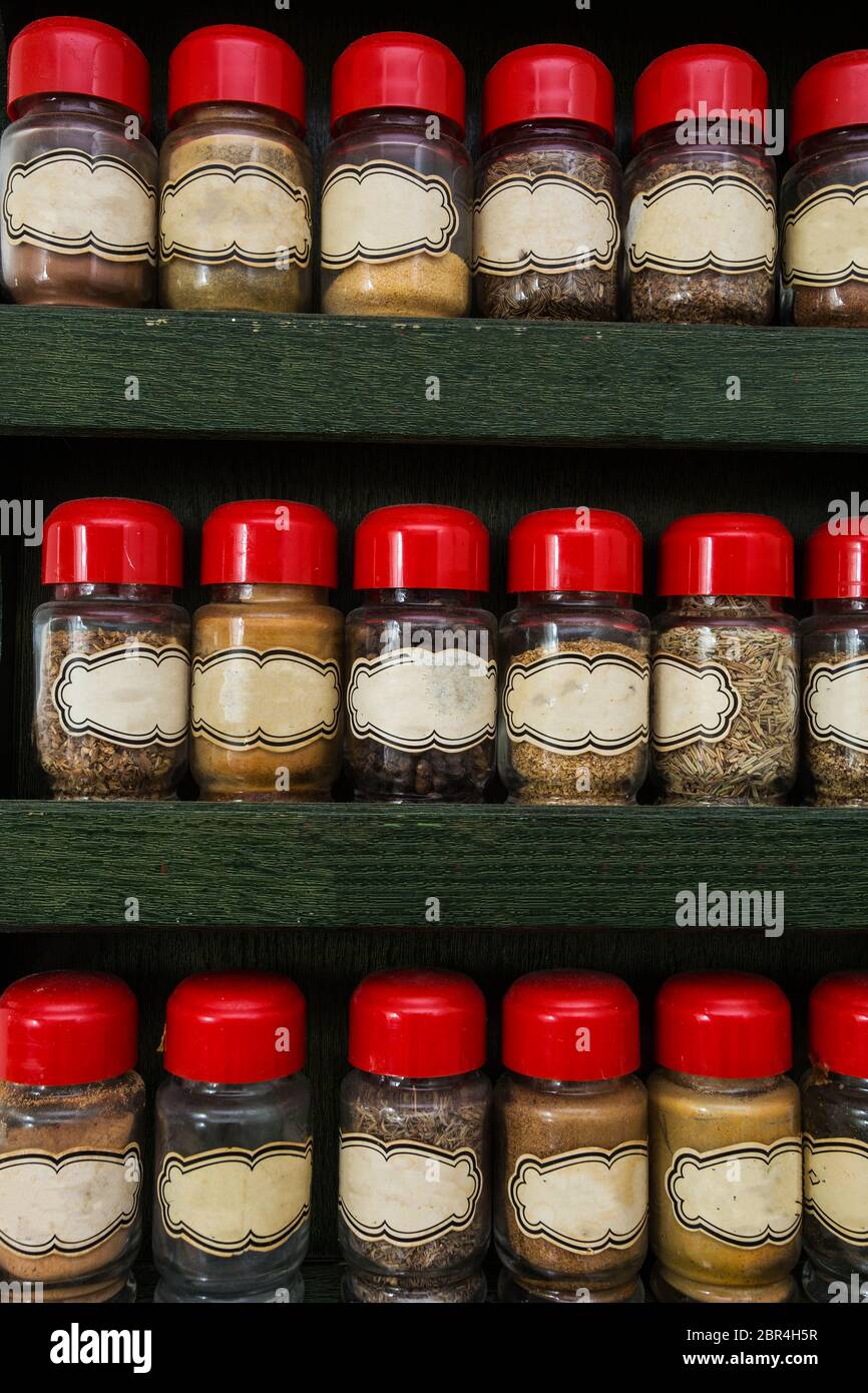 https://c8.alamy.com/comp/2BR4H5R/jars-of-herbs-and-spices-in-wooden-rack-on-white-background-vintage-design-close-up-2BR4H5R.jpg