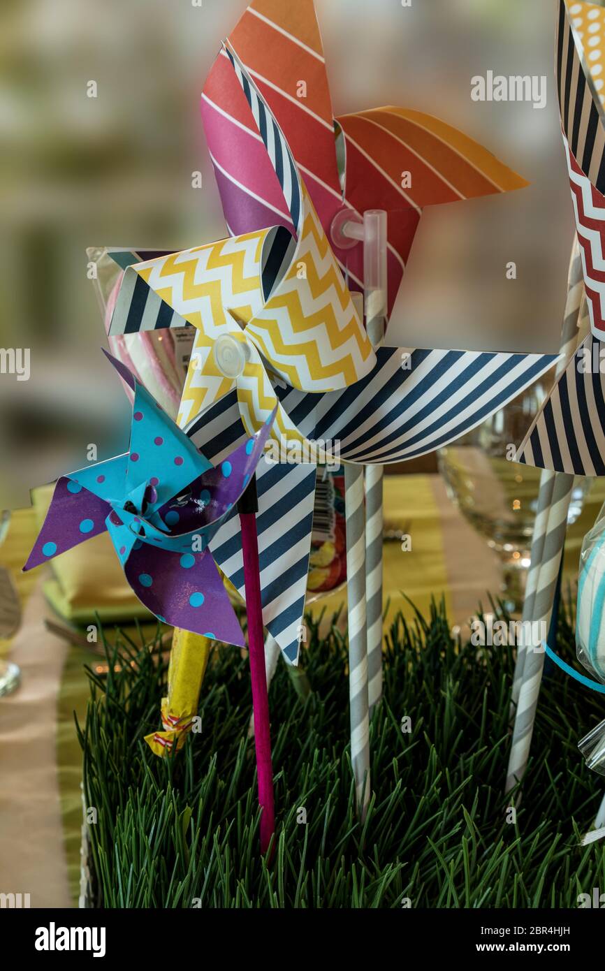 Pinwheel State Fair Decorations In A Bed Of Fake Grass At A Children S Party Stock Photo Alamy