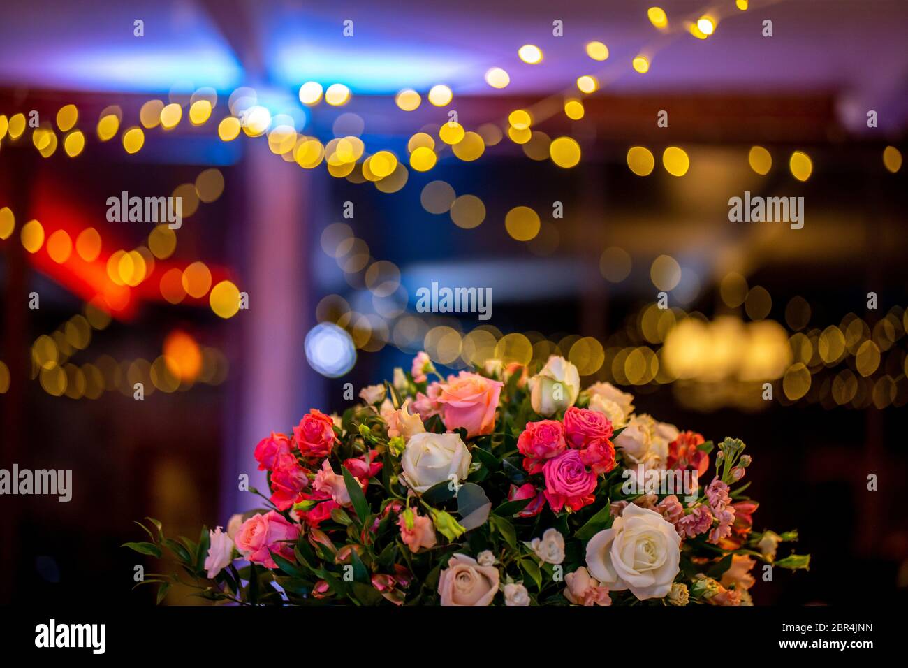 Bouquet of flowers on background of colorful bokeh light. Closeup of wedding flowers bouquet and blurred colorful lights in Stock Photo - Alamy