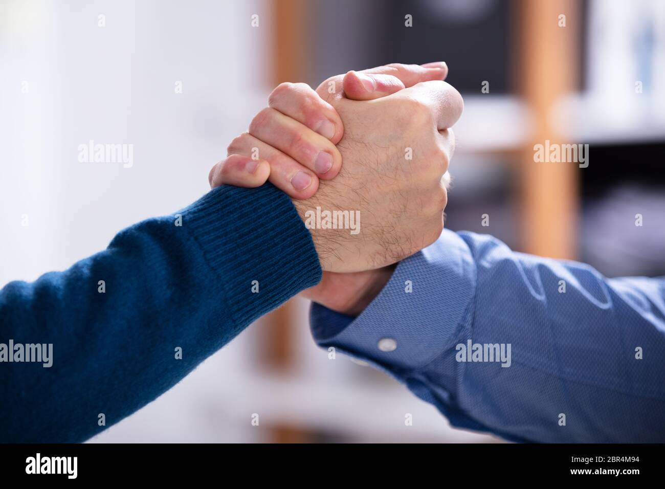 Close-up Of A Two Businessman Competing In Arm Wrestling Stock Photo