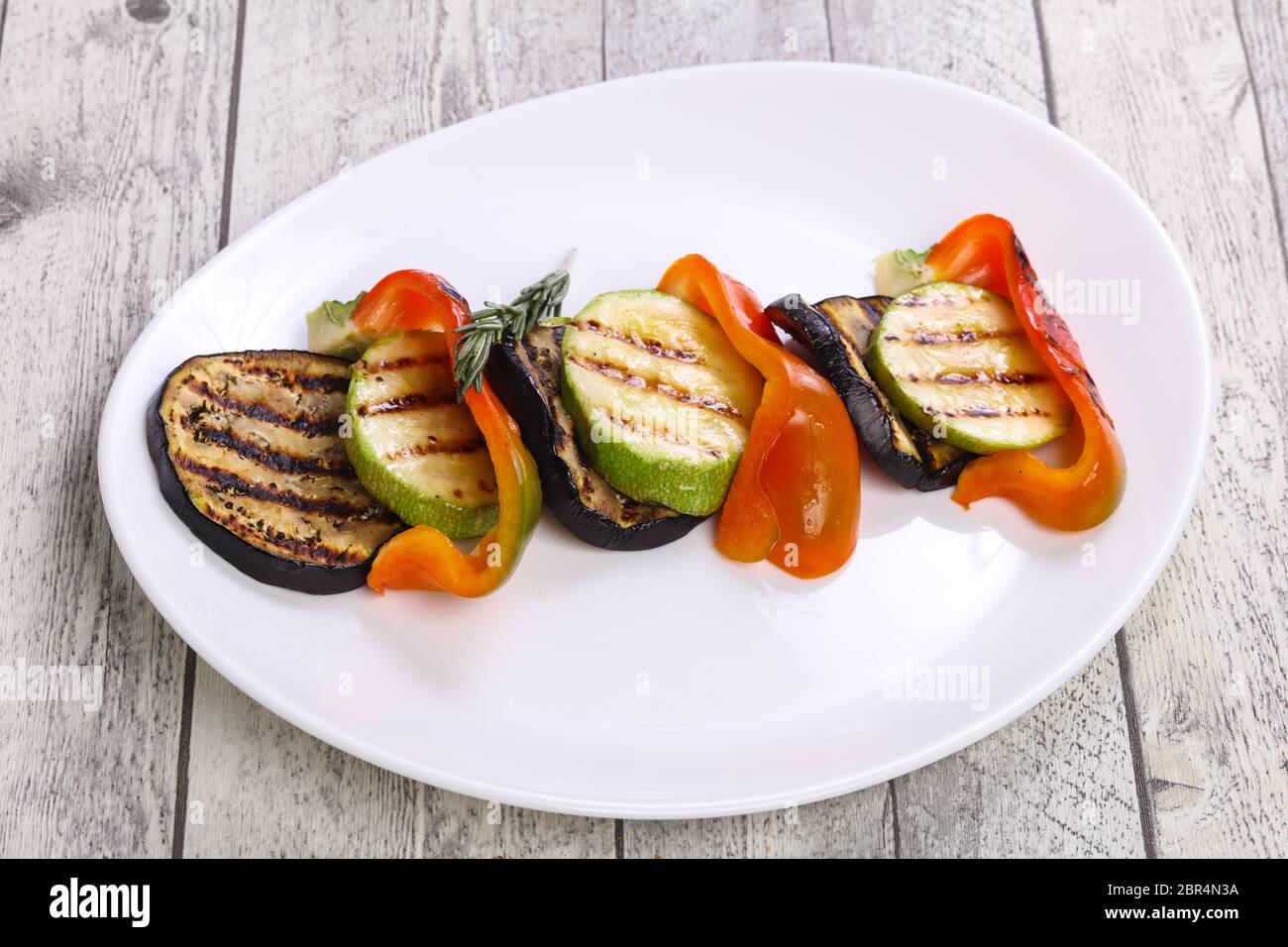 Grilled vegetables eggplant, zucchini and pepper in the plate Stock