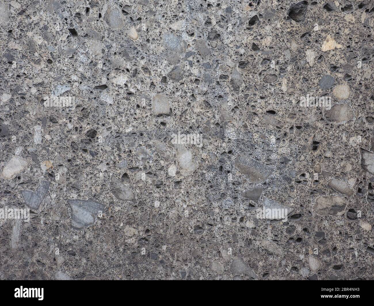 grey stone wall useful as a background Stock Photo - Alamy