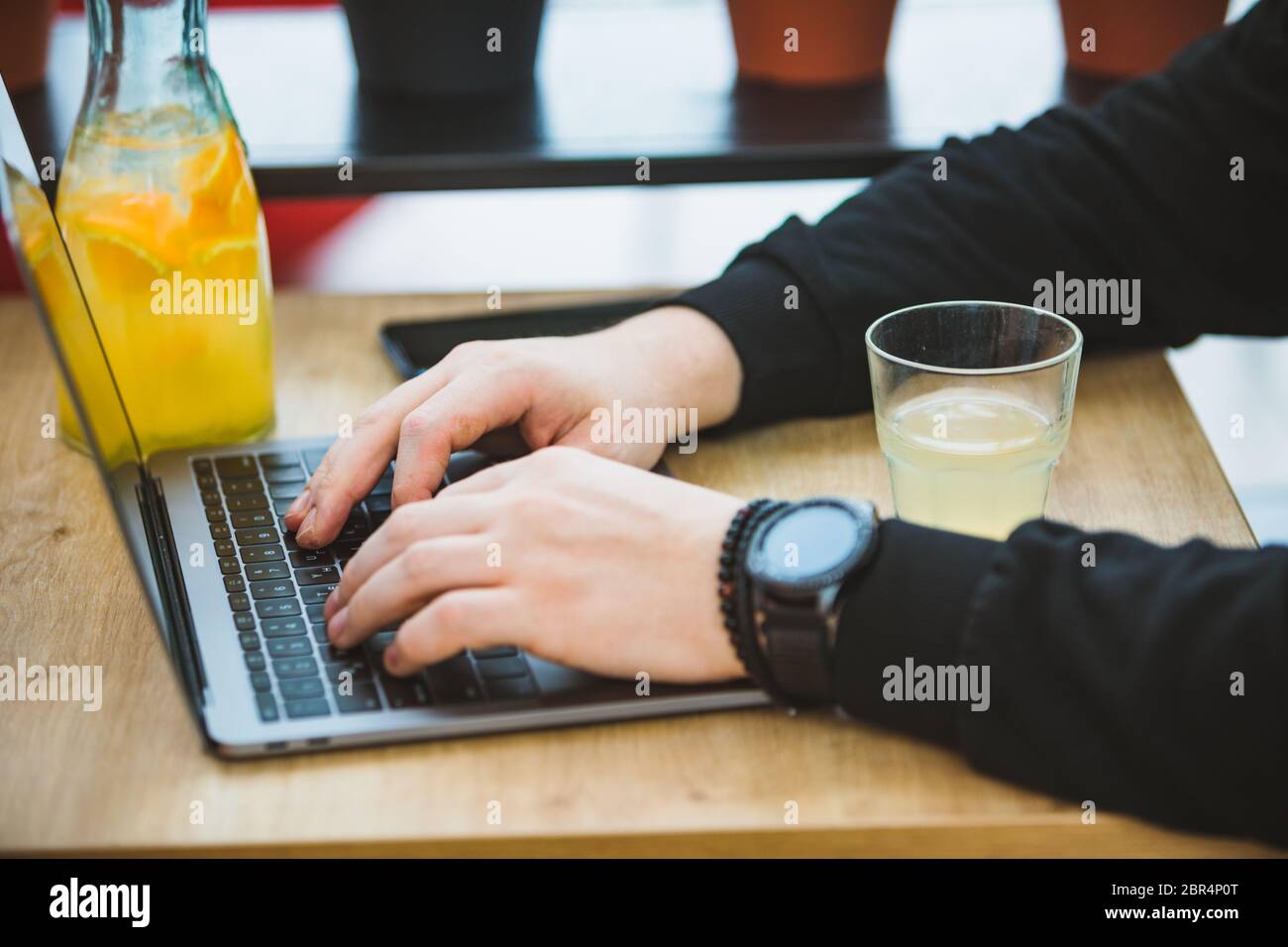 mans hands on laptop keyboard freelance concept Stock Photo