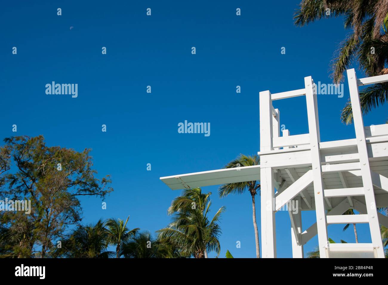 White diving board in tropical scenery and clear blue sky Stock Photo