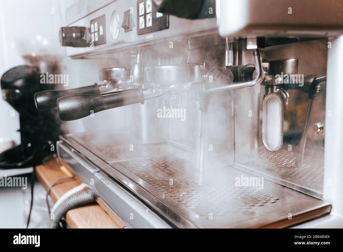The coffee machine steams when making coffee Stock Photo Alamy