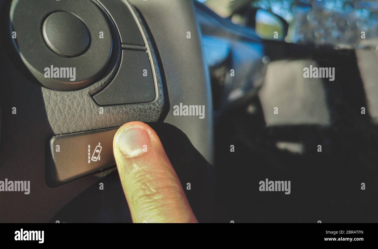 Lane change assist system button on the steering wheel of car Stock