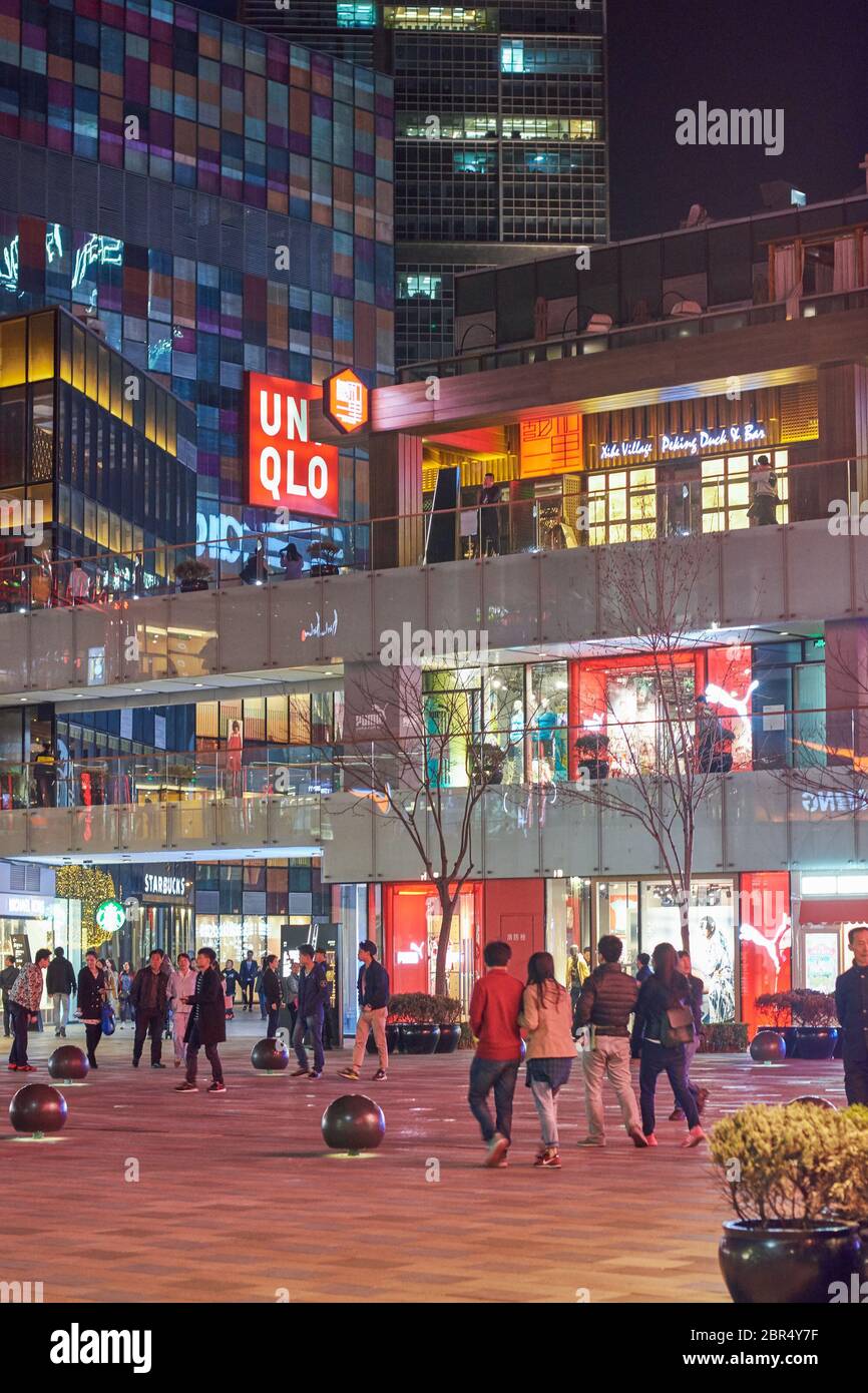 Beijing / China - March 24 2016: Night view of the luxurious shopping and restaurant/bar area of Sanlitun in downtown Beijing, China Stock Photo