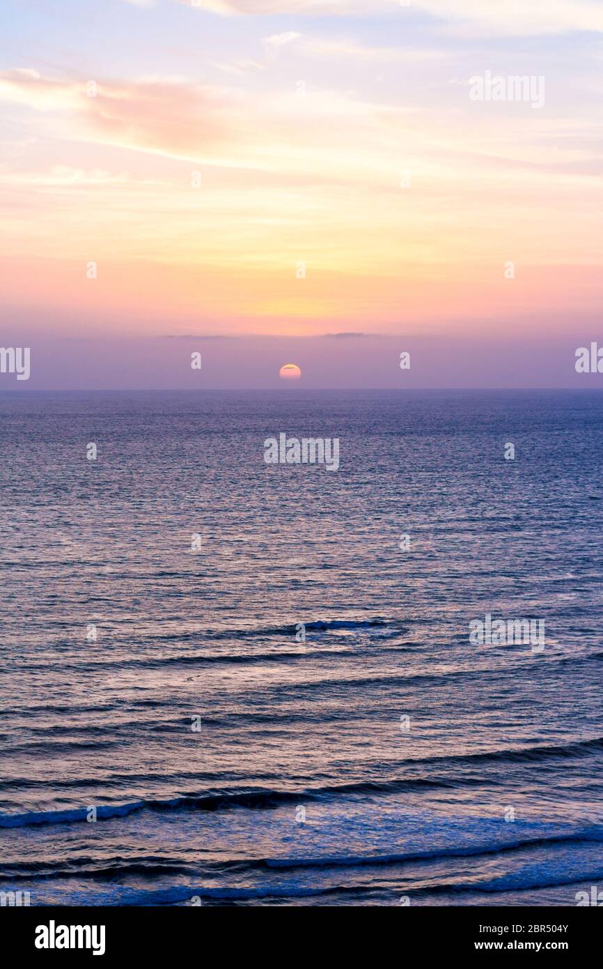 Goa, India - Warm Sunset from Chapora Fort, Vagator Beach. Pint-sized Goa is more than beaches and trance parties. A kaleidoscopic blend of Indian pop. Stock Photo