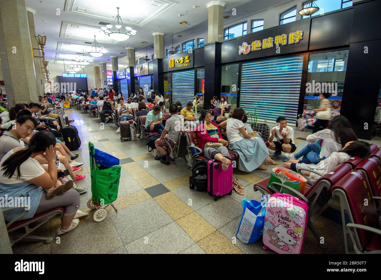 Beijing / China - July 23, 2016: People waiting for trains in Beijing main railway station Stock Photo