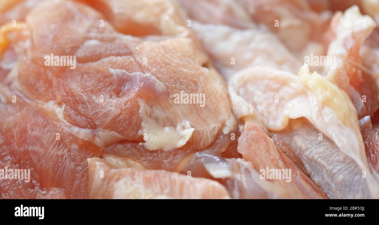 Raw chicken thigh Stock Photo - Alamy