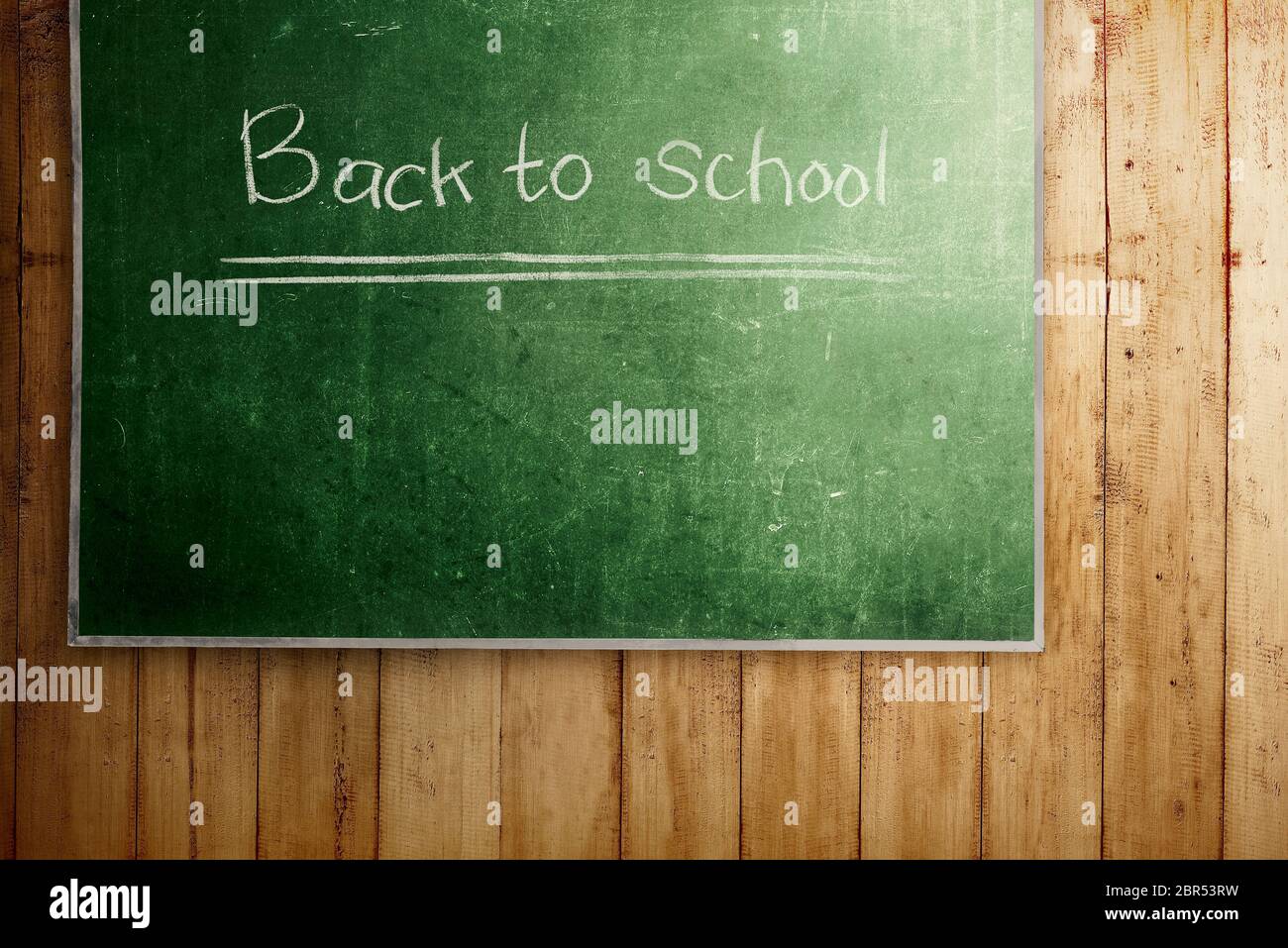 Chalkboard with Back to School message on wooden wall. Back to School ...