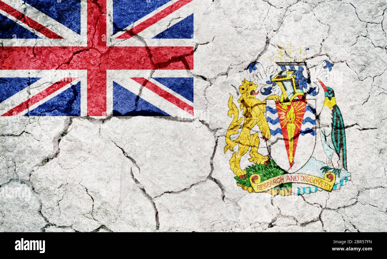 Flag of the British Antarctic Territory on dry earth ground texture