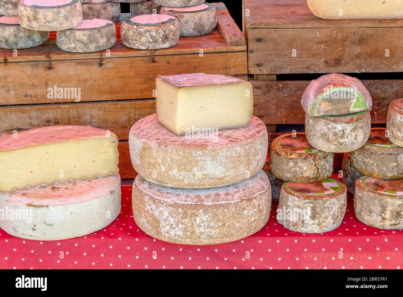 various cheese wheels at a market seen in France Stock Photo Alamy