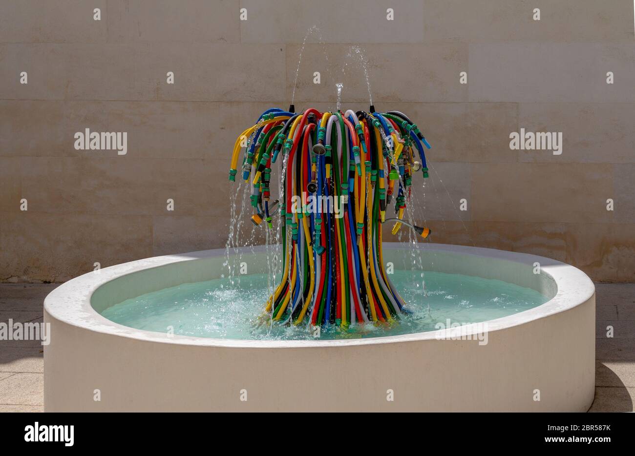 fountain made of lots of various garden hoses Stock Photo Alamy
