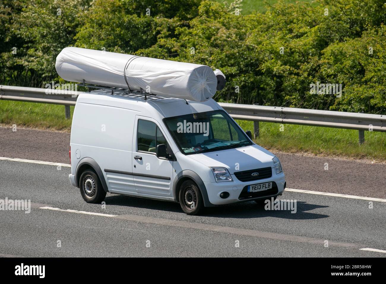 2013 white Ford Transit Connect 90 T230 T; Carpet delivery van; Vehicular  traffic moving vehicles, commercial vans driving vehicle on UK roads,  motors, motoring on the M6 motorway highway Stock Photo - Alamy