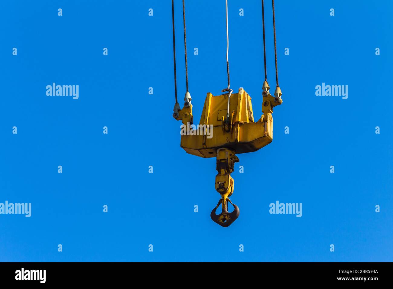 Crane arm lifting machine with cables dual pulleys to hoist hook Stock