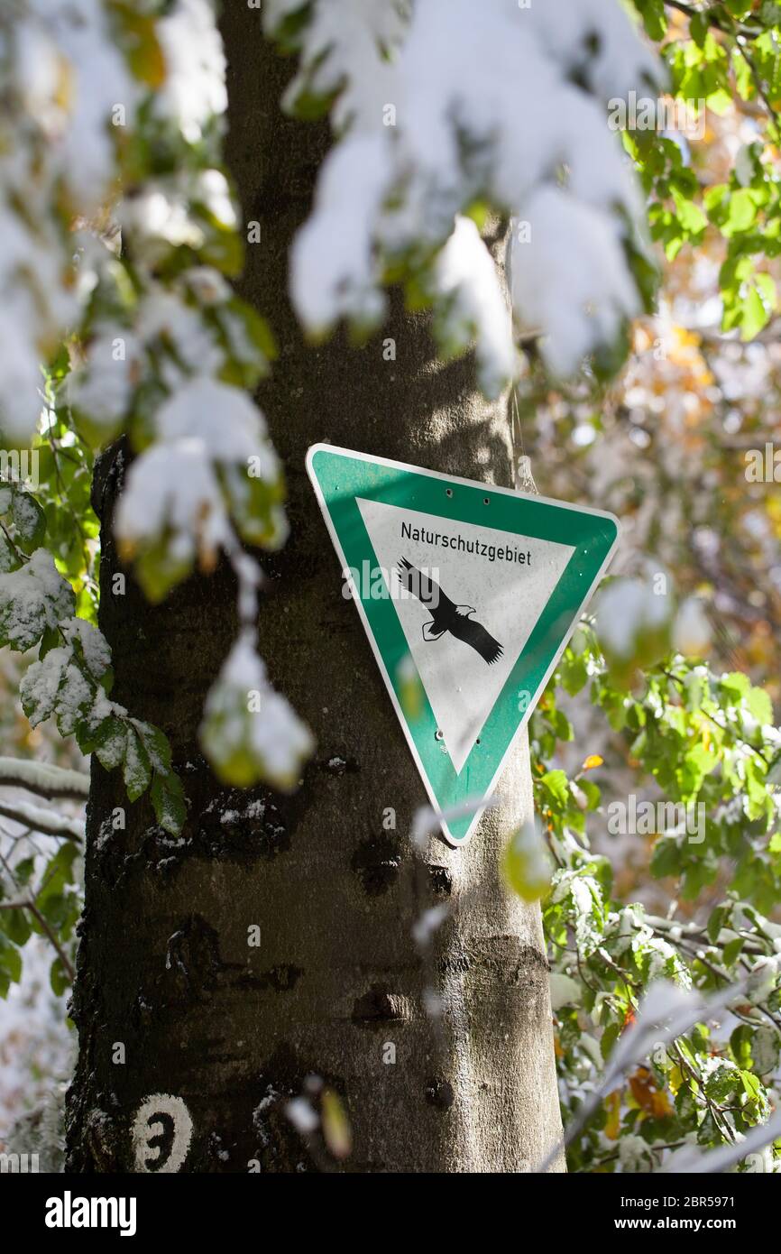 German sign 'Naturschutzgebiet' means nature reserve or conservation area in English language Stock Photo