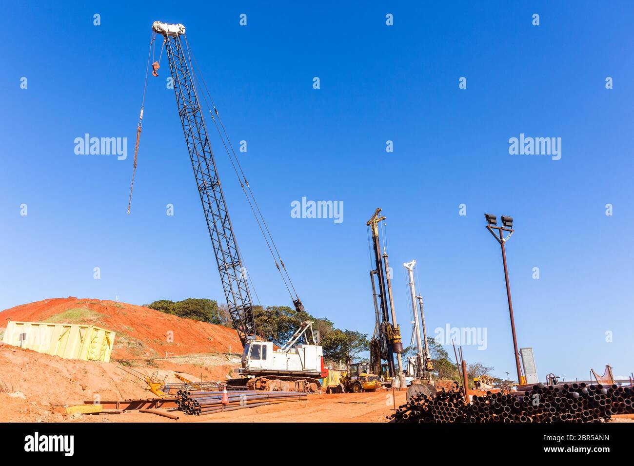 Construction cranes pylons new roadworks traffic junction Stock Photo
