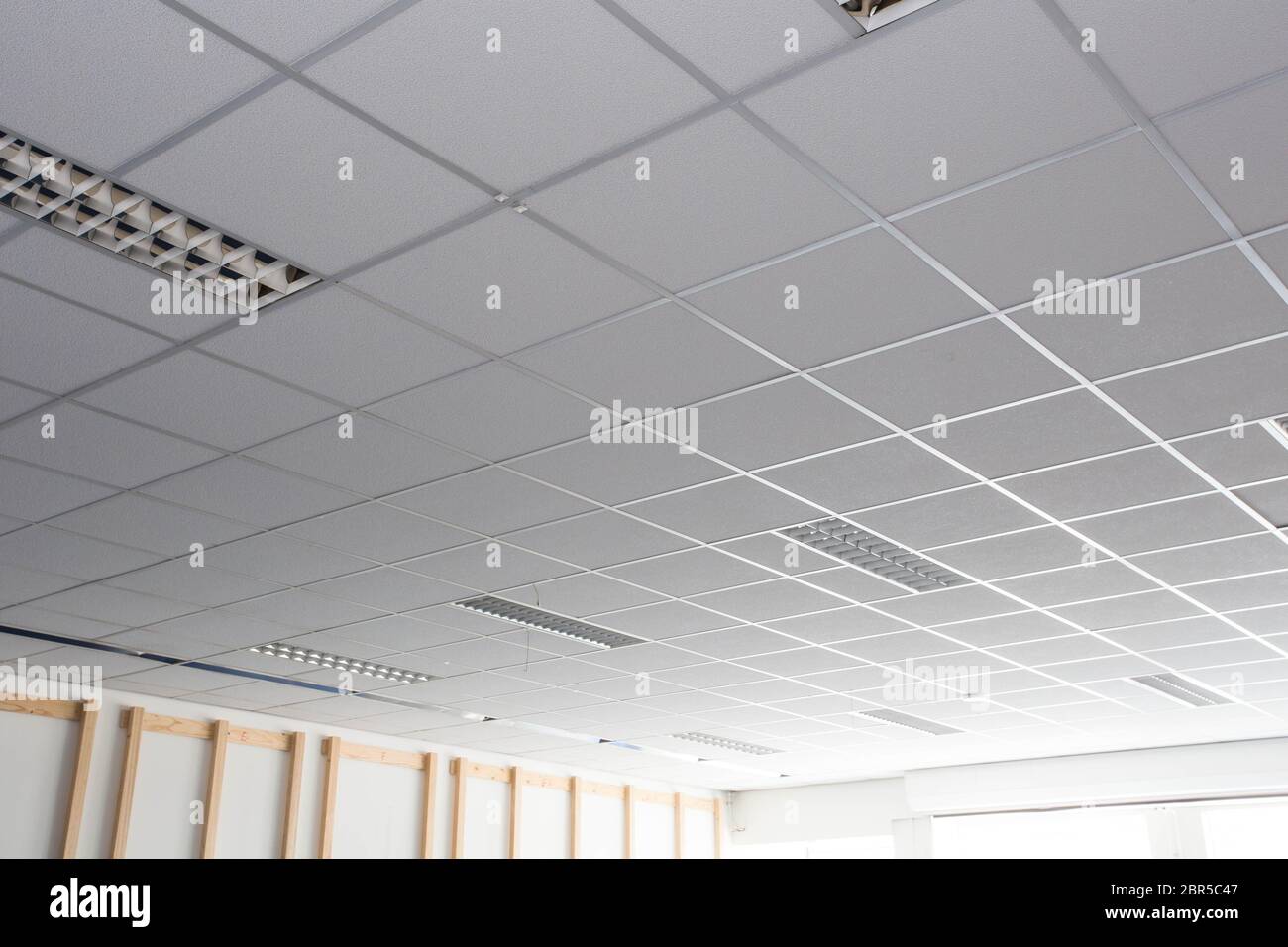 Suspended ceiling with LED square lamps sin the office close-up Stock Photo  - Alamy