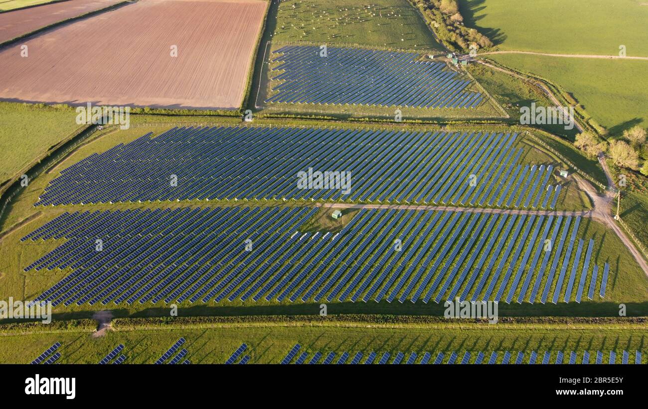 Photovoltaic power station.Solar Farm, solar panels on green fields, farmland, transforming solar light into electricity.Haverfordwest Pembrokeshire. Stock Photo