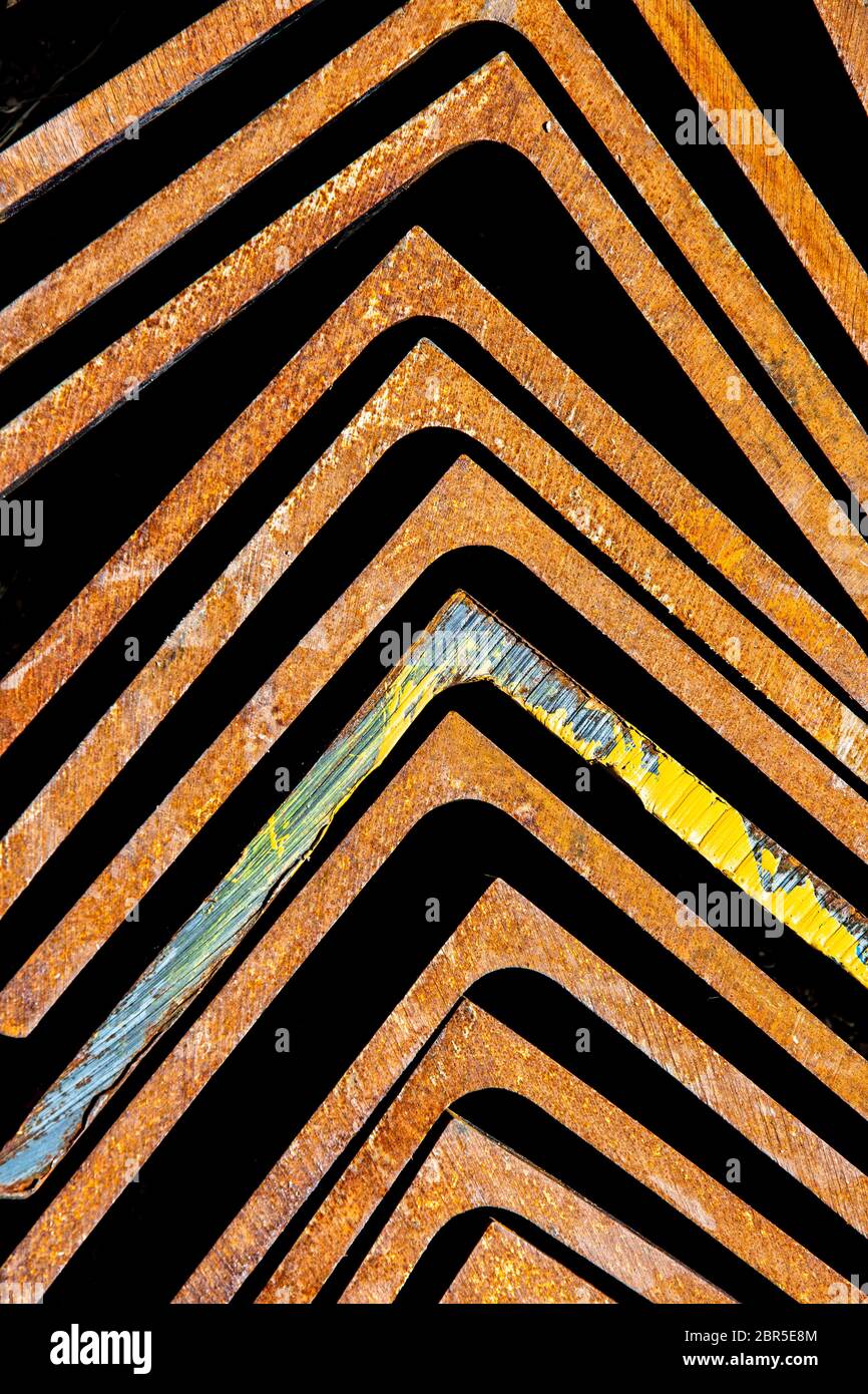 Rusty metal brackets pointing towards top of frame Stock Photo Alamy