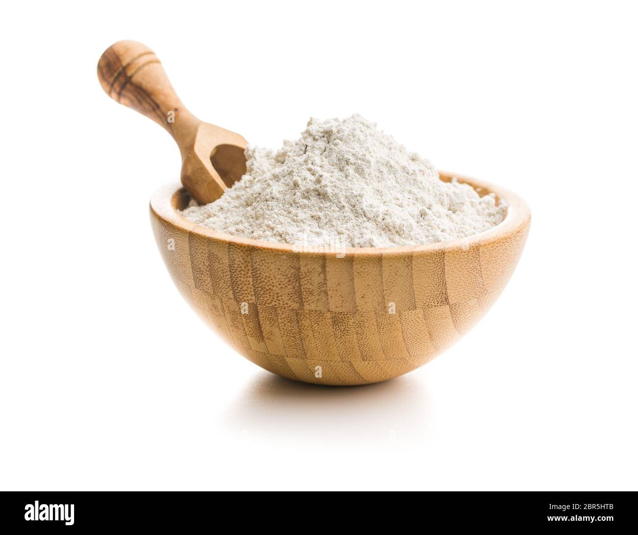 Whole grain wheat flour in bowl isolated on white background Stock