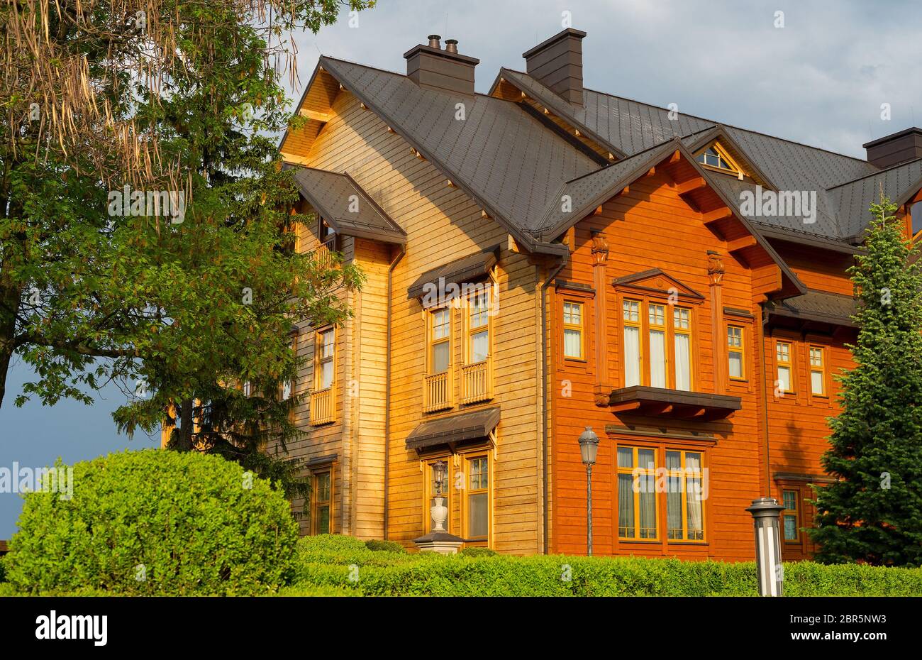 Large wooden house in a sunset light. Ukraine Stock Photo Alamy